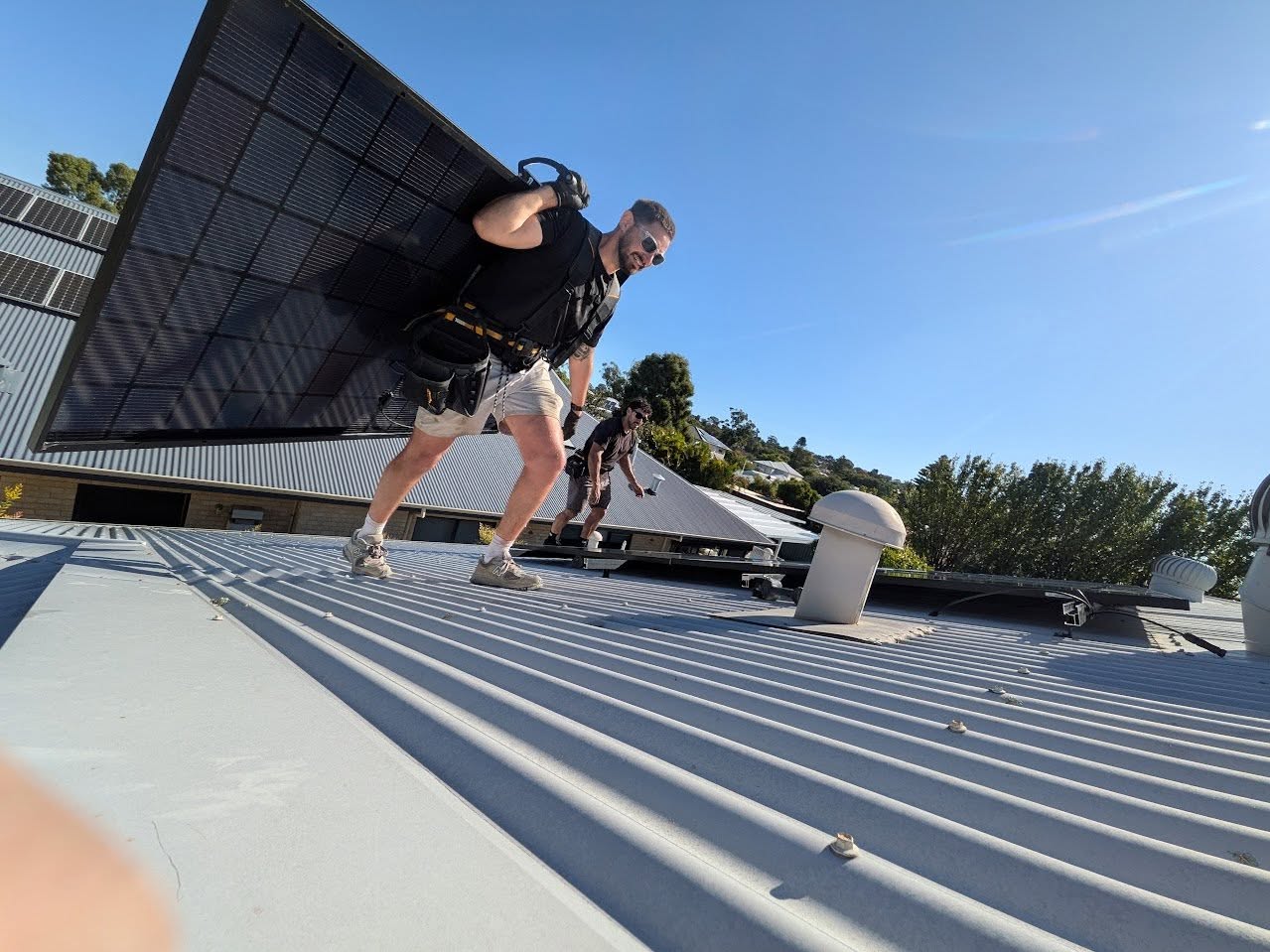 Perth Solar and Air team installing solar panels on a Perth roof